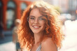 Charming sensual young woman in eyeglasses looking at camera with smile at spring city street