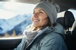 Female driving a car in sunny day, travel in the mountains, freedom active. Woman traveling, exploring, enjoying the view of the mountains, landscape, lifestyle concept winter vacation outdoors.