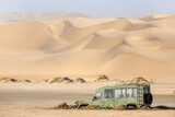 Fototapeta Tulipany - 4x4 car stuck in the sand of Namib desert, Namibia, Africa