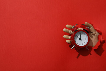 Wall Mural - Red alarm clock on a red background