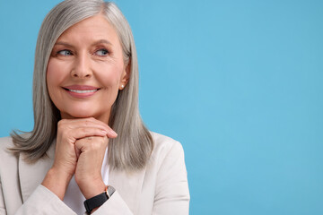 Sticker - Portrait of beautiful middle aged woman on light blue background, space for text