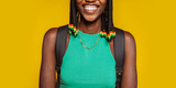 Close up portrait of a happy smiling young african american woman in green top, braids and backpack at studio isolated over yellow background. No face.