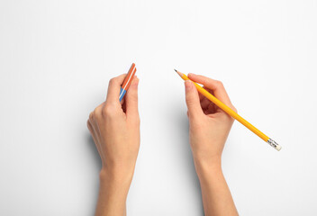 Canvas Print - Woman with graphite pencil and eraser on white background, top view