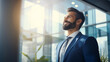 © Keitma - Confident Middle-Eastern businessman in a suit standing in an office