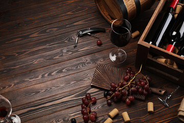 Wall Mural - Winemaking. Composition with tasty wine and barrel on wooden table, above view. Space for text