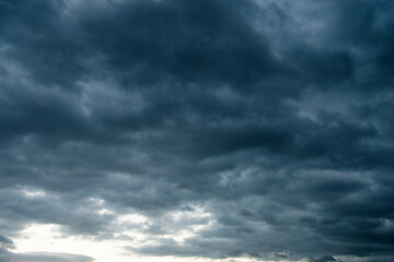 Wall Mural - Dark and dramatic storm clouds on the sky