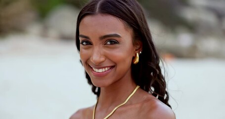 Poster - Woman, face and relaxing on beach, smiling and happy in outdoors or travel to ocean for fun. Indian female person, portrait and satisfaction or free in nature, peace and calm on holiday or getaway