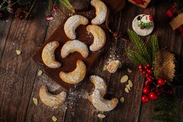 Sticker - Holiday Almond crescent shortbread cookies on festive background, selective focus