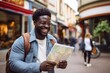 African American man exploring a city, smiling with a map in hand
