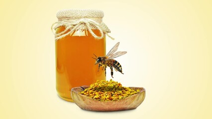 Wall Mural - honey in jar, flower pollen and flying bee isolated