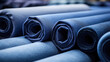 Fabric rolls in blue color, closeup of fabric rolls for sewing, atelier and handmade. Background for fabric store, accessories for sewing.