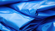 Closeup of Protective blue tarpaulins for construction sites, water repellent films for repair and exterior construction work, awnings and canopies.
