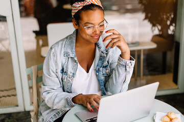 Professional freelancer enjoying a coffee break at a local cafe