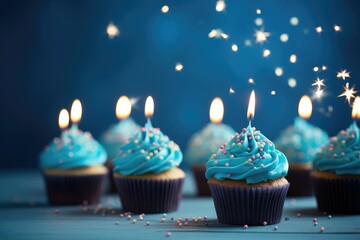 Wall Mural - Cupcakes with buttercream frosting and colored sprinkles on blue background, Birthday cupcake with candle on wooden table with bokeh background, Birthday cupcake adorned with, AI Generated