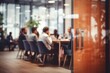 Blurred view of business meeting through office glass door