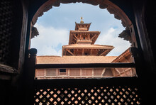 Real Architecture Masterpiece Old Temple View Through The Carved Wood Window, Patan Durbar Square Royal Medieval Palace And UNESCO World Heritage Site. Lalitpur, Nepal.