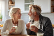 © DJSPIDA FOTO - The happiness of a senior male and female couple drinking milk. For strong health, strengthen bones, nourishing the brain, concepts of taking care of your health and body.