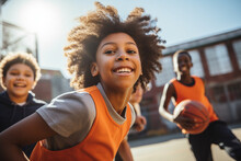 Black Children Play Basketball In The School Yard On A Sunny Day Outdoors