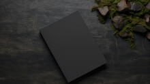 A Close-up Of A Black Leather Pocket Book On A Black Background.
