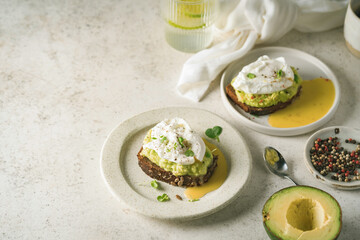 Wall Mural - Avocado toast with poached egg on white background. Healthy Breakfast concept.