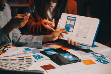 Wall Mural - team of ui ux web designer are working together to develop mobile responsive websites. mobile mockup
