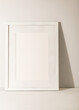 © Bidwell Studio - White frame leaning on white plaster wall