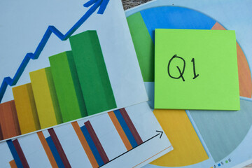 Wall Mural - Concept of Q1 - 1st Quarter Period write on sticky notes isolated on Wooden Table. Stock market concept