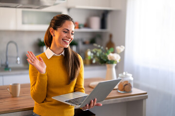 Wall Mural - Confident businesswoman executive coach in casual clothes using laptop computer, having video conference call virtual meeting, professional training negotiation, remote working from home.