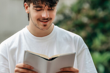 Sticker - young man with book on the street outdoors