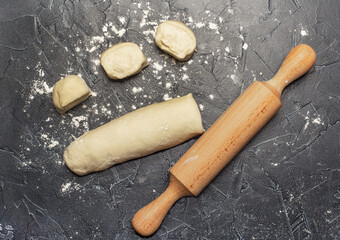 Wall Mural - ball of fresh raw dough, flour and rolling pin top view