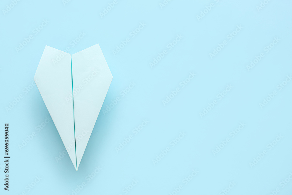 Paper plane on blue background