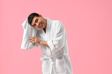 Poster - Handsome man wiping hair after washing on pink background