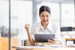 © David - Young happy business asian woman working with tablet in corporate office
