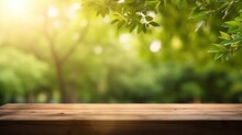 Empty Wooden Tabletop On Blurred Abstract Green Foliage Background From Garden On Sunny Background. Montage Or Design Product Background