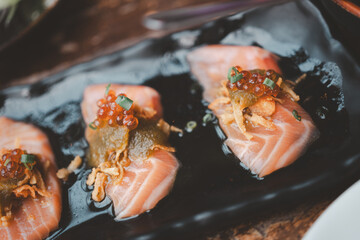 Wall Mural - Spicy salmon salad with salmon roe and seafood sauce on top