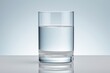 glass of water on sleek reflective blue to white background, depicting hydration and balance
