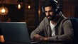 © Fly Frames - man talking in front of a camera for vlog and using a laptop, headphones and a microphone