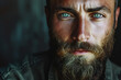 Portrait of a man with a rugged beard, piercing green eyes, and a strong jawline