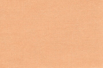 Wall Mural - Color of the year 2024 peach fuzz. Light coral background from textile material with wicker pattern,.