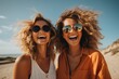 © pham - Two women wearing sunglasses and smiling at the camera