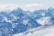 Snow-covered winter mountains of the Caucasus on a sunny day. Panoramic view from the ski slope of Elbrus, Kabardino-Balkaria, Russia