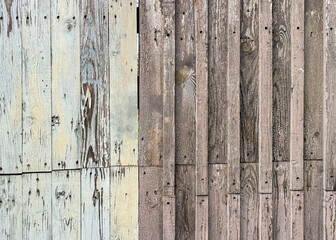 Wall Mural - Boards on an old wooden fence as an abstract background. Texture