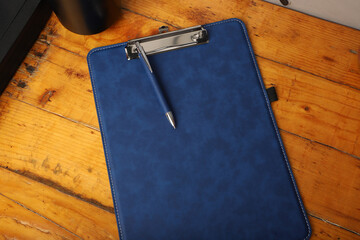 Colorful leather clipboard. Genuine leather clipboard, concept shot, top view, different color, clamshell and stitched clipboard. Blue color clipboard