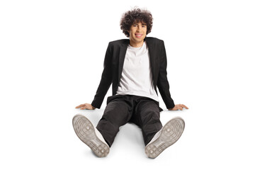 Sticker - Young man with curly hair sitting on the floor