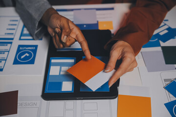 team of UI UX web designer are working together to develop mobile responsive websites. Mobile Mockup