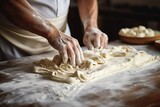 Fototapeta  - The cook's male hands close making pasta