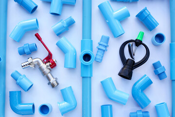 Plumber equipment with blue pvc pipe connections for plumbing work.