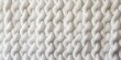 White Knit Fabric Background. Wool Sweater Texture Close Up Surface backgrounds.
