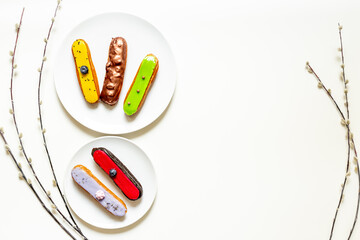 Wall Mural - Many various glased eclairs with chocolate and berrie. Sweet food background