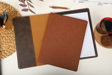 Leather Portfolio. Concept Shot, Top View, Portfolio In Brown Colors And Leather Pen. Custom Background Flap Portfolio View. Portfolio And Accessories.